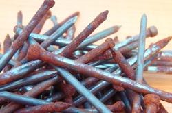 image of nails in various stages of corrosion. 